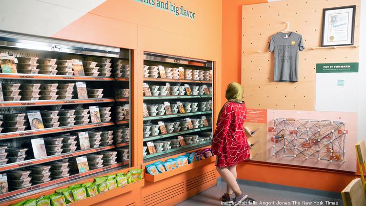 A customer considers the grab-and-go meals at an Everytable location in Los Angeles on Oct. 8, 2021. The fast-casual concept is expanding to New York City and seeking to open 100 locations over the next five years.