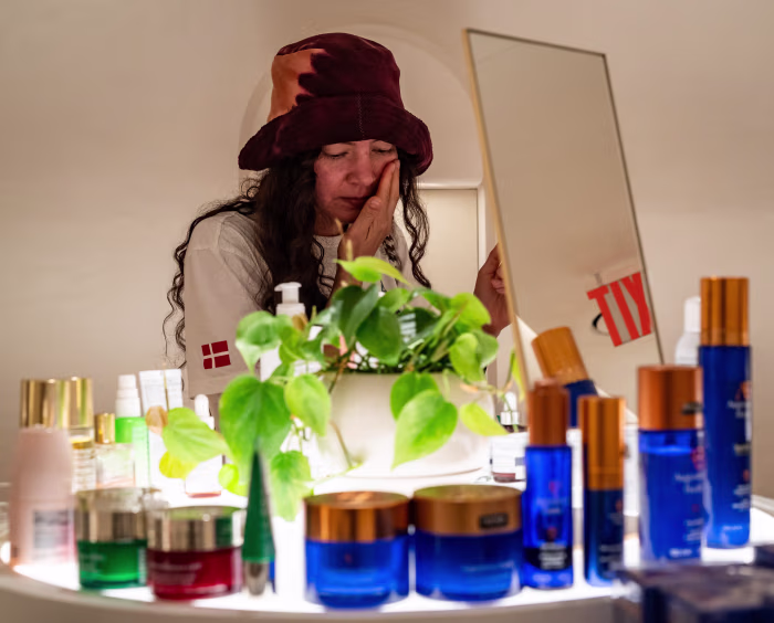 Aisha Gunnell of Brooklyn tries products on display in the Beauty Corridor at Printemps New York.